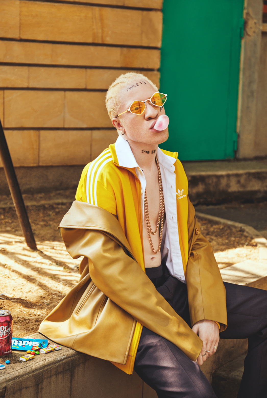 Portrait in yellow jacket with gum bubble